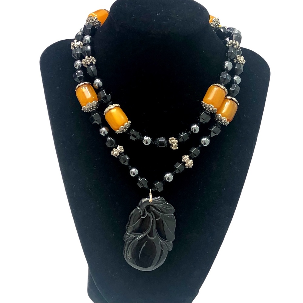 AMBER, ONYX & HEMATITE NECKLACE WITH CARVED ONYX PENDANT